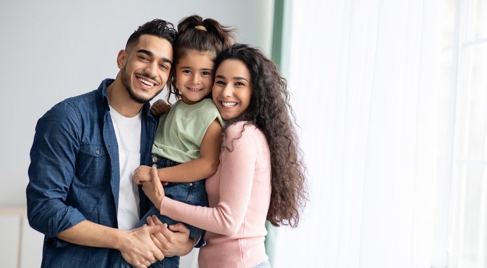 Portraif,Of,Happy,Arabic,Parents,Posing,With,Their,Little,Daughter